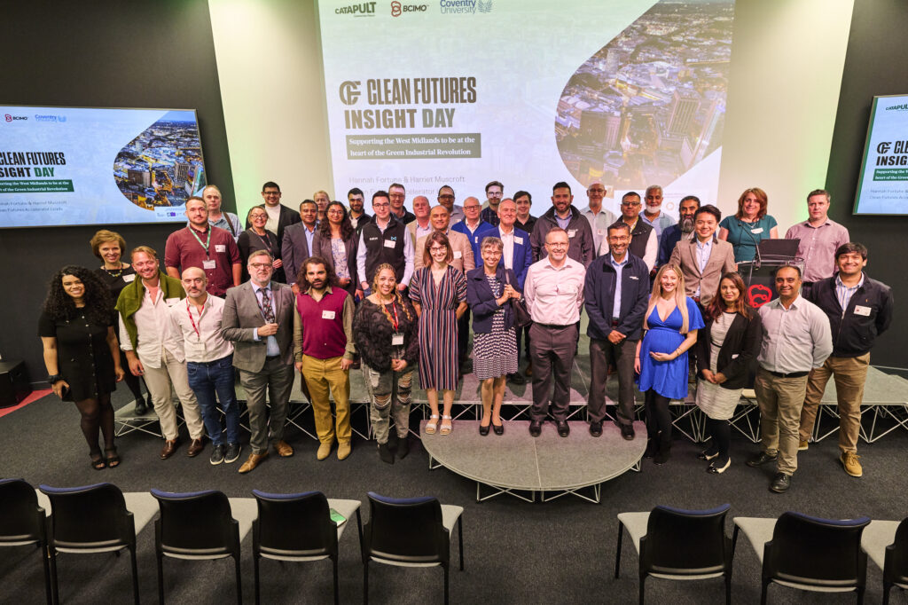 Group photo of the clean futures cohort on stage